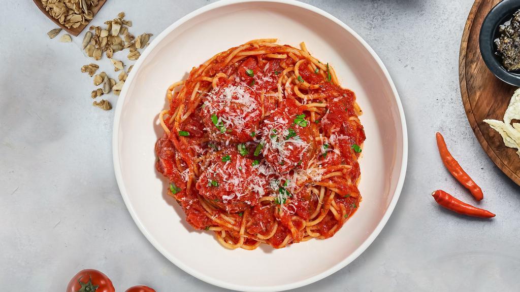 Kid'S Spaghetti With Meatball · Fresh spaghetti and homemade ground beef meatballs served with rossa (red) sauce, red pepper flakes, and parmesan.