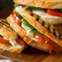 Meatless Panini · Grilled Panini Sandwich made with Mozzarella cheese, plum tomatoes, basil, spinach, sundried...