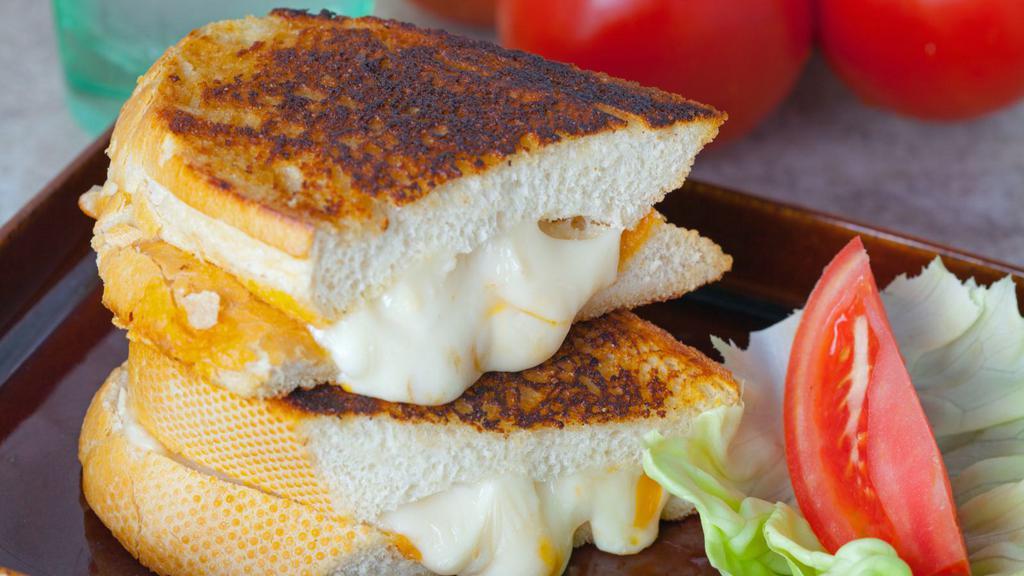Swiss Grilled Cheese Sandwich · Delicious sandwich made with Swiss cheese, and customer's choice of bread. Topped with butter and grilled to perfection!.