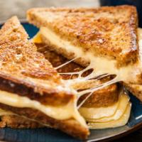 Cheddar Grilled Cheese Sandwich · Delicious sandwich made with Cheddar cheese, and customer's choice of bread. Topped with but...