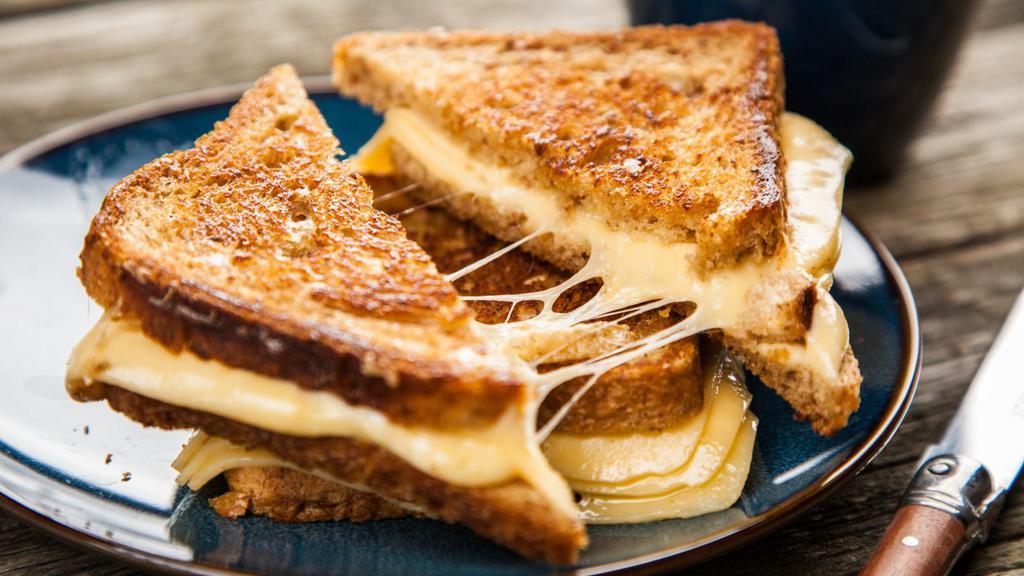 Cheddar Grilled Cheese Sandwich · Delicious sandwich made with Cheddar cheese, and customer's choice of bread. Topped with butter and grilled to perfection!.