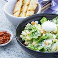 Caesar Salad · Freshly prepared salad topped with Romaine lettuce, sliced romano cheese, and homemade garli...