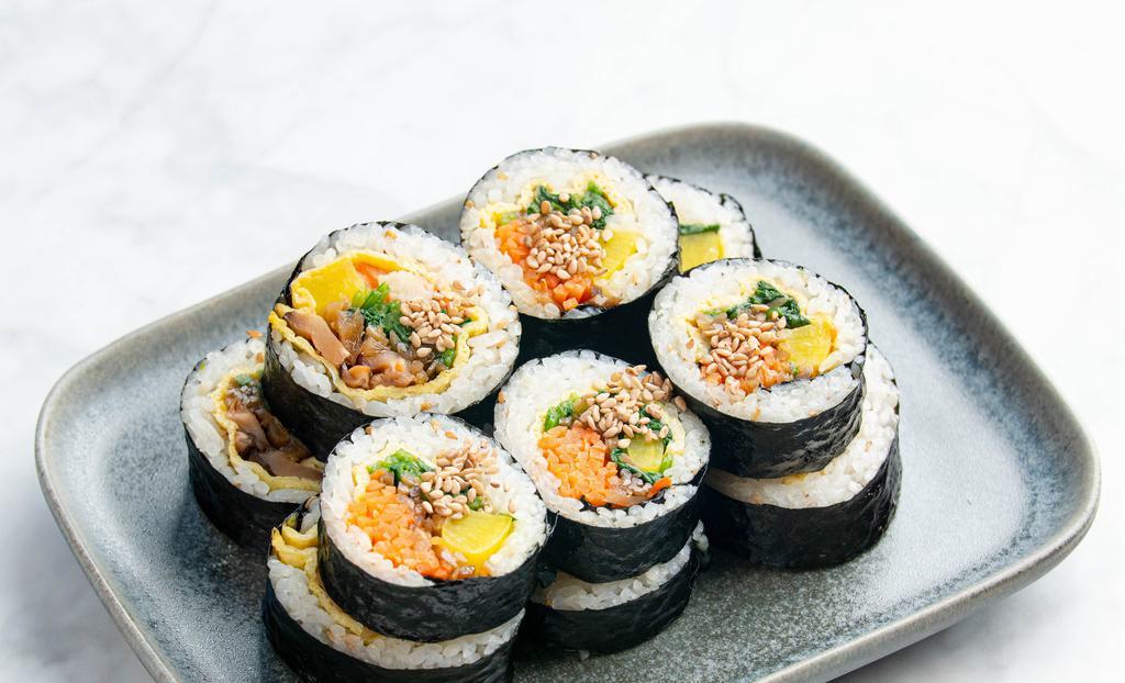 김밥 Kimbap · Dried seaweed paper wrapped Korean rice rolls w/ sauteed vegetables, egg, & choice of your toppings