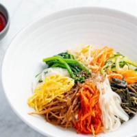 비빔밥 Bibimbap · Sauteed and seasoned vegetables over rice served with sunny side up and choice of topping. s...