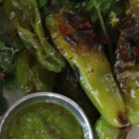Blistered Shishito Peppers · Gluten-free. Served with coriander sauce & citrus salt.