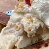 Molten Peanut Butter Banana Split · Van ice cream, salted peanuts, over whipped cream & a cherry