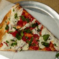 Margherita Pizza · San Marzano tomato, fresh mozzarella, basil, olive oil and garlic with Reggiano Parmigiano o...
