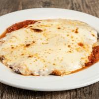 Parmigiana · Breaded and fried cutlet with melted mozzarella in tomato sauce.