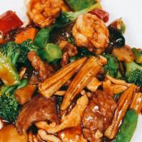 Triple Delight · Sliced beef, chicken, and shrimp sautéed with assorted Chinese vegetables in brown sauce.