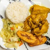 Curry Chicken · Served with rice, vegetables, and plantain.
