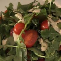 Julius Salad · Baby arugula, cherry tomatoes, and shaved parmesan.