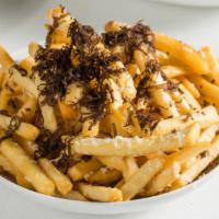 Patatine Fritte Con Tartufo E Parmigiano · French fries, truffle, and parmigiano.