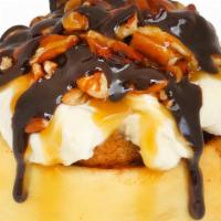 Turtle · Caramel and cream cheese frosting topped with pecans, warm caramel sauce and chocolate drizz...
