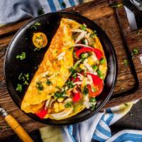 German Omelette · Delicious Omelette cooked with 3 eggs and topped with Bacon, Onions, Tomato, and Swiss Chees...