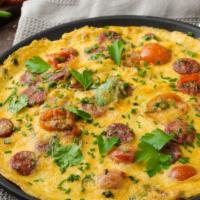 Meat Lover'S Omelette · Delicious Omelette cooked with 3 eggs and topped with Bacon, Ham, and Sausage. Served with c...