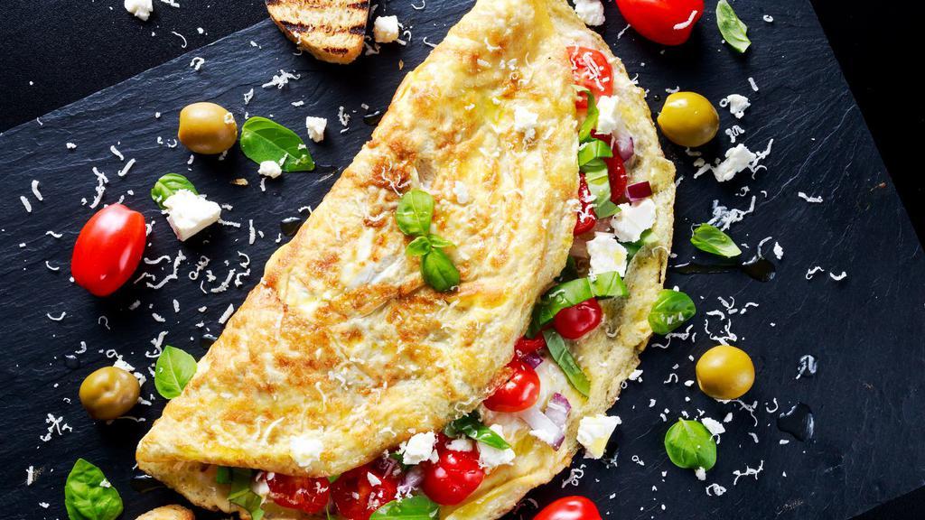 Vegetarian Omelette · Delicious Omelette cooked with 3 eggs and topped with Spinach, Mushrooms, and Tomatoes. Served with customer's choice of toast and potatoes.