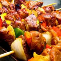 Kebab · Grilled meat on a stick lazed with suya