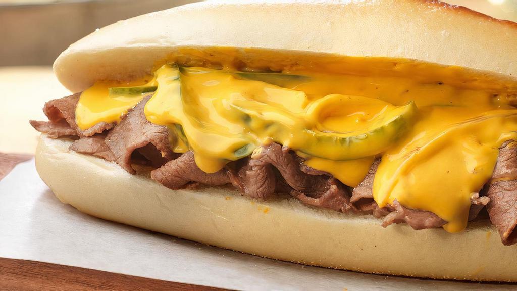 Philly Cheese Steak · Thinly Sliced, Sautéed Rib Eye Beef, Melted Cheese on a Hero with Onion, Green Pepper, Mayonnaise & Ketchup.