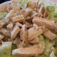 Mexican Chicken Caesar Salad · Fresh romaine lettuce, croutons, and grilled chicken in a homemade caesar dressing topped wi...