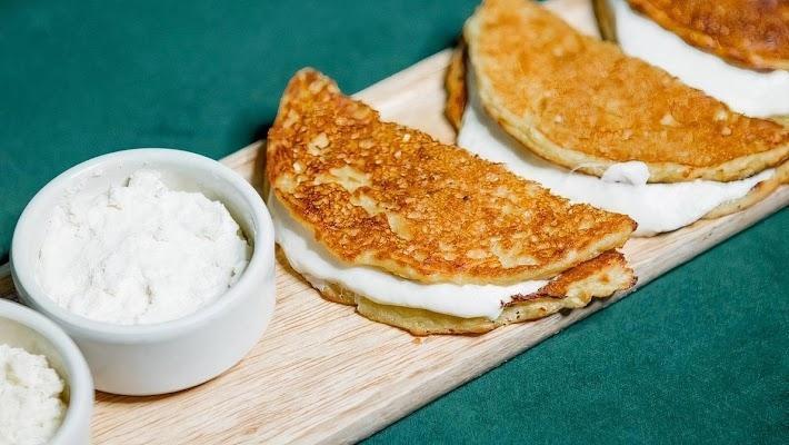 Cachapitas · (3) Mini Venezuelan corn pancake, queso blanco & nata.