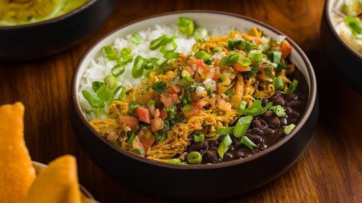 Shredded Chicken Bowl · Shredded chicken breast with jasmine rice and black beans, and pico de gallo gluten-free.