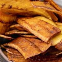 Plantain Chips · Side of fried green plantain chips.