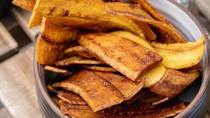 Plantain Chips · Side of fried green plantain chips.