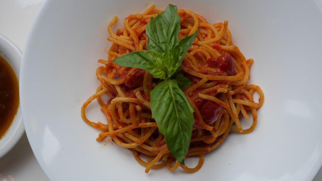 Spaghetti Chitarra Al Pomodoro E Basilico · Fresh cherry tomato, garlic and basil sauce.