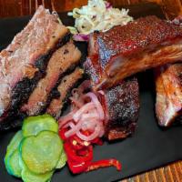 2 Meat Platter · Your choice of 2 meats with an optional assortment of pickled veggies & slaw.