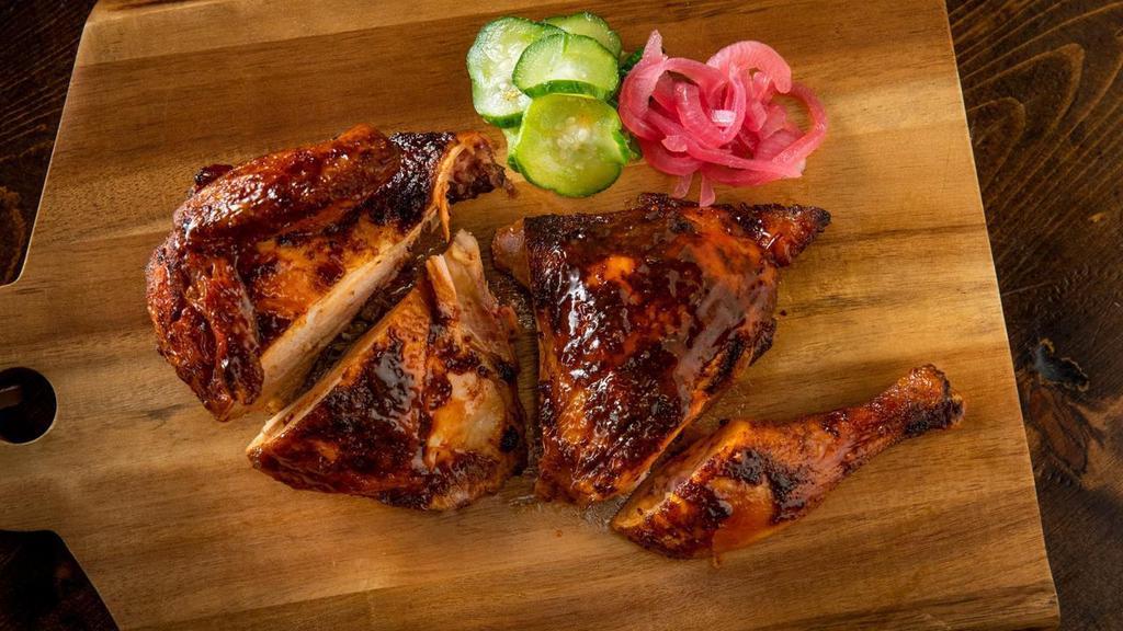 Half Chicken · Naturally raised slow-smoked chicken. Served with an optional assortment of pickled veggies & slaw.