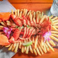 Fire Roasted Lobster On A Bed Of Fries · 