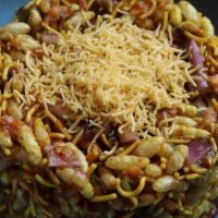Bombay Bhel · A cold salad of puffed rice, diced onions, cilantro and tamarind chutney.