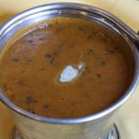 Dal Makhani · Whole black lentils, kidney beans, clarified butter.