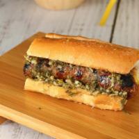 Choripan · Grilled Argentinian sausage topped with our housemade Chimichurri.