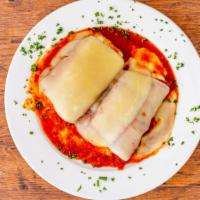 Eggplant Rollatini  · Slices of eggplant, dusted in wheat flour or lightly breaded and covered with ricotta and ot...