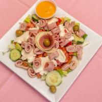 Classic Antipasto Salad · Diced tomatoes, chunks of fresh mozzarella cheese, red onions & green peppers topped with ol...
