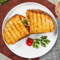 Thrill Of The Clucking Grill Panini · Chicken, lettuce, tomato, fresh mozzarella & roasted peppers.