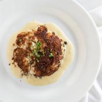 Baltimore Crab Cake · Made with jumbo lump crabmeat, baked with cracker crust & lemon caper aioli.