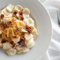Bacon Macaroni And Cheese · White cheddar cheese sauce.