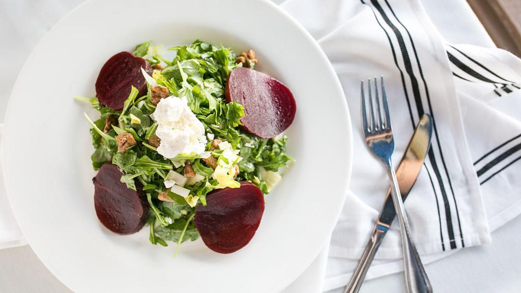 Roasted Beets Salad · Red beets, arugula & endive with glazed walnuts tossed in a sherry vinaigrette & EVOO topped with goat cheese.