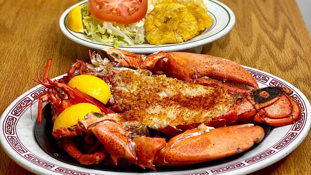 Langosta Asado · Broiled Lobster served with salad and tostones.