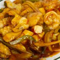 Mariscos Enchilado · Seafood with Hot Sauce [Fish, Shrimp, Scallops, Calamari, Mussels] served with white rice.