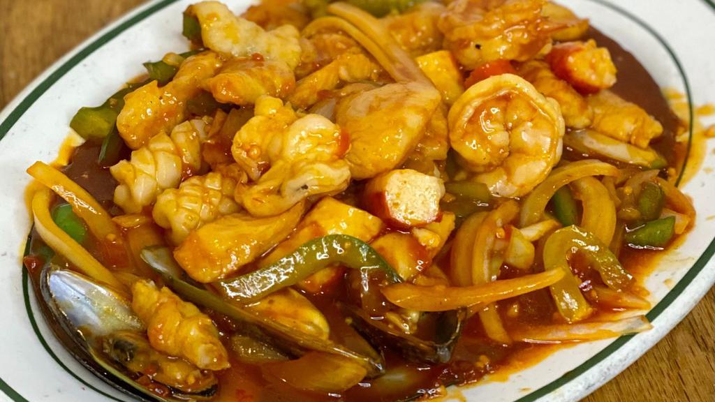 Mariscos Enchilado · Seafood with Hot Sauce [Fish, Shrimp, Scallops, Calamari, Mussels] served with white rice.