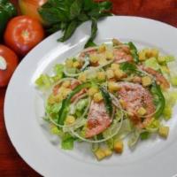 Grilled Chicken Over Caesar Salad · 