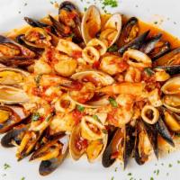 Seafood Risotto · Risotto sauteed with clams, mussels, shrimp, scallops and calamari in a shallots cognac sauc...