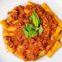 Rigatoni Bolognese · Our homemade delicious meat sauce.