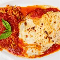 Chicken Parmigiana · Breaded chicken cutlet with tomato sauce and melted mozzarella cheese.