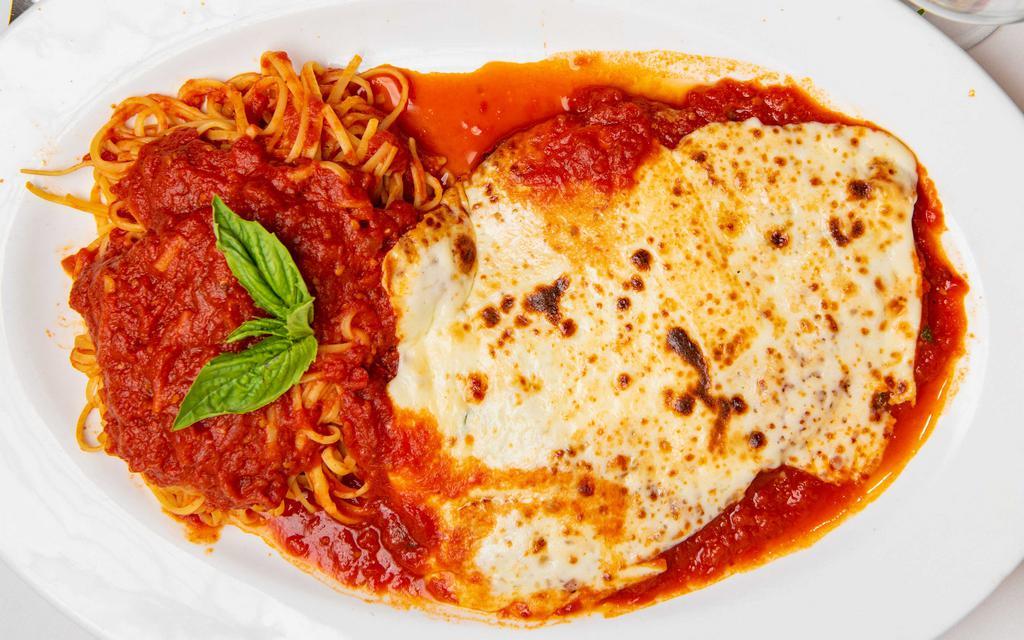 Chicken Parmigiana · Breaded chicken cutlet with tomato sauce and melted mozzarella cheese.