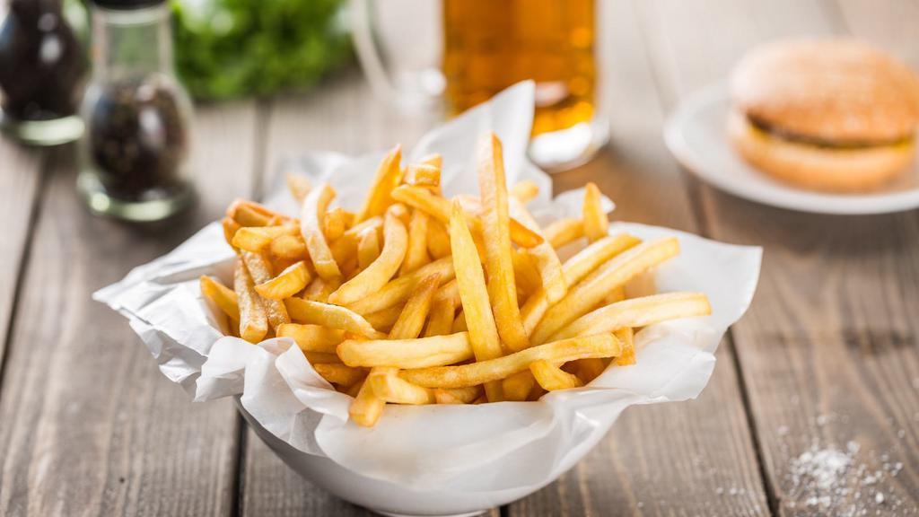 Basket Of French Fries · Golden potato fries served in batch.