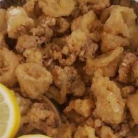 Fried Calamari · Flash fried squid, crunchy on the outside and simply perfect on the inside. Kick it up a not...